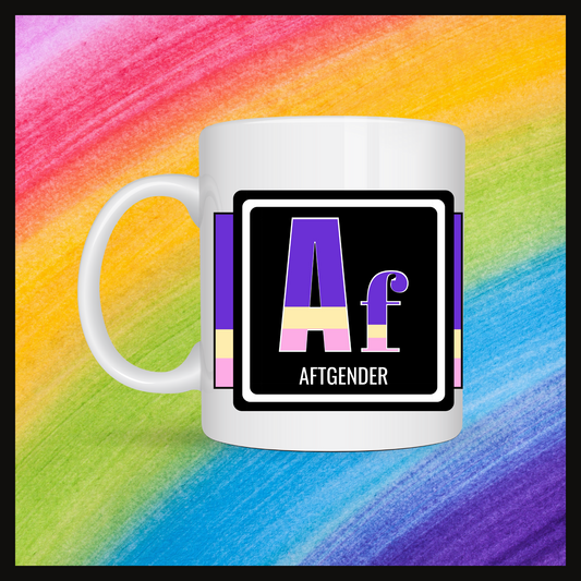 White mug with a 3 inch square containing the element’s symbol (Af) and name (Aftgender). Symbol is made with the colors of that element’s flag on a black background. The pride flag is displayed behind the symbol. Behind the mug is a rainbow background.