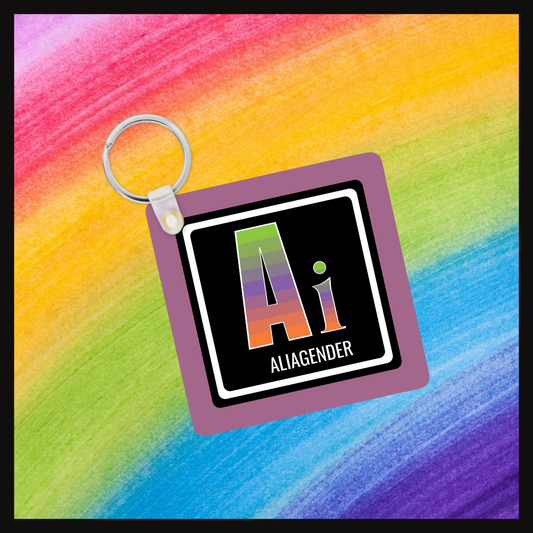Keychain with the  Element symbol (Ai) and name (Aliagender) with a design based on the colors of that element’s flag in a black square with a purple background. Behind the keychain is a rainbow background.