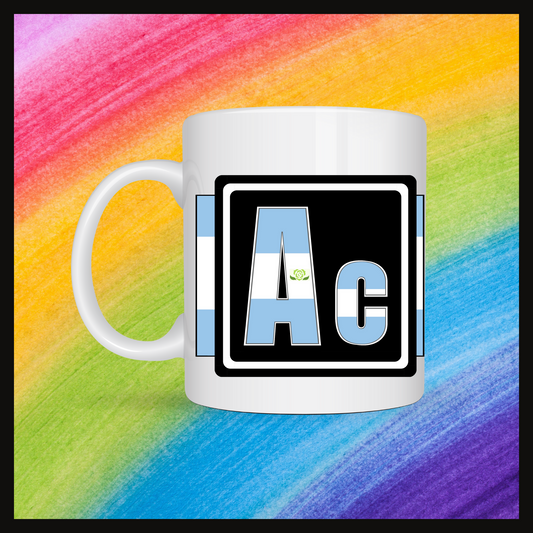 White mug with a 3 inch square containing the element’s symbol (Ac). Symbol is made with the colors of that element’s flag on a black background.