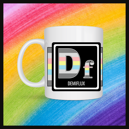 White mug with a 3 inch square containing the element’s symbol (Df) and name (Demiflux). Symbol is made with the colors of that element’s flag in a black square with the element’s flag behind the square. Behind the mug is a rainbow background.