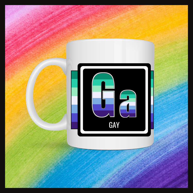 White mug with a 3 inch square containing the element’s symbol (Ga) and name (Gay). Symbol is made with the colors of that element’s flag in a black square with the element’s flag behind the square. Behind the mug is a rainbow background.
