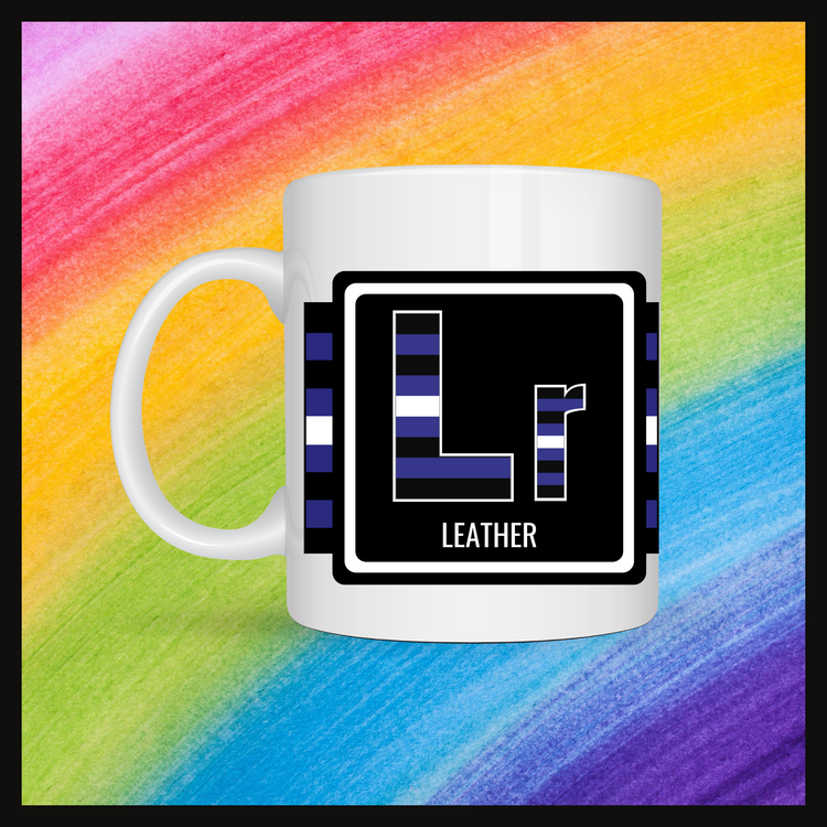 White mug with a 3 inch square containing the element’s symbol (Lr) and name (Leather). Symbol is made with the colors of that element’s flag in a black square with the element’s flag behind the square. Behind the mug is a rainbow background.