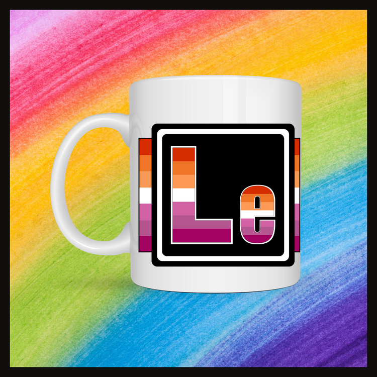 White mug with a 3 inch square containing the element’s symbol (Le). Symbol is made with the colors of that element’s flag in a black square with the element’s flag behind the square. Behind the mug is a rainbow background.