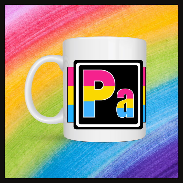 White mug with a 3 inch square containing the element’s symbol (Pa). Symbol is made with the colors of that element’s flag in a black square with the element’s flag behind the square. Behind the mug is a rainbow background.