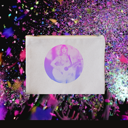 The background is multi-colored glitter and hands at a concert. The makeup bag shown is another graphic of  Taylor on stage. 