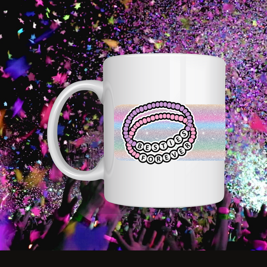This 11 oz ceramic mug is in th center of the photo which says Besties Forever. 