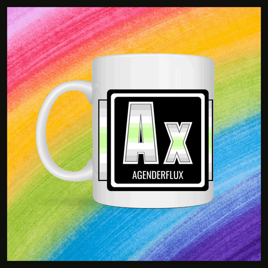 White mug with a 3 inch square containing the element’s symbol (Ax) and name (Agenderflux). Symbol is made with the colors of that element’s flag on a black background. The pride flag is displayed behind the symbol. Behind the mug is a rainbow background.