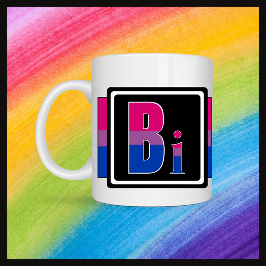 White mug with a 3 inch square containing the element’s symbol (Bi). Symbol is made with the colors of that element’s flag in a black square with the element’s flag behind the square. Behind the mug is a rainbow background.