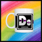 White mug with a 3 inch square containing the element’s symbol (De) and name (Demisexual). Symbol is made with the colors of that element’s flag in a black square with the element’s flag behind the square. Behind the mug is a rainbow background.