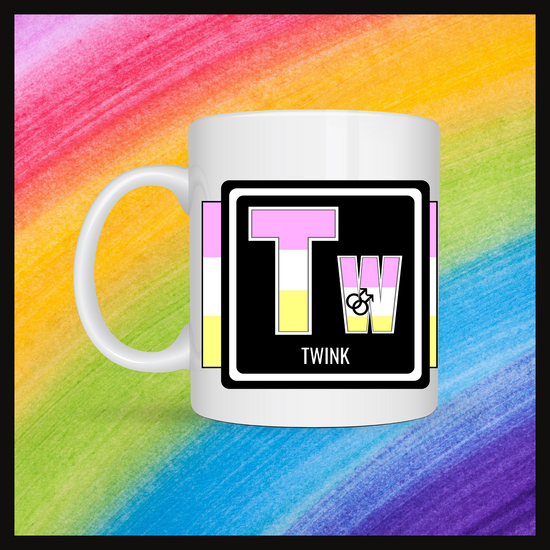 White mug with a 3 inch square containing the element’s symbol (Tw) and name (Twink). Symbol is made with the colors of that element’s flag in a black square with the element’s flag behind the square. Behind the mug is a rainbow background.